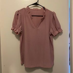Ruffled pink blouse